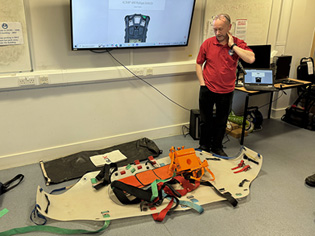 BCRC Equipment officer Mike Clayton talking about new stretcher features.