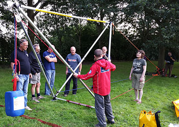 Team members discussing ideas for different ways of rigging the Larkin frame.