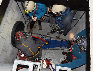Moving a stretcher casualty in a confined space.