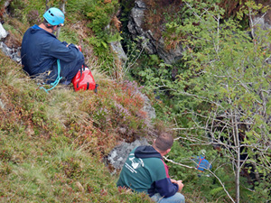 A rescuer reaches Bill and carefully puts him in a hauling bag (Pic: Kelvin Lake)