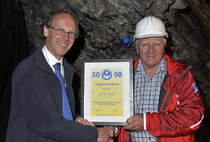 Paul Taylor, Chairman of Gloucestershire CRG (left) presenting John Smith (right) with his 50 year long service award.
