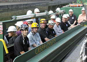 Team members and guests preparing for the underground boat trip.
