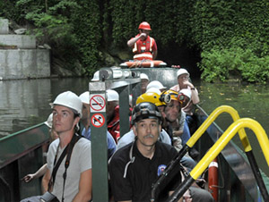 Dudley Canal Trust boat ferrying team members and guests through Castle Mill basin into the limestone mines.