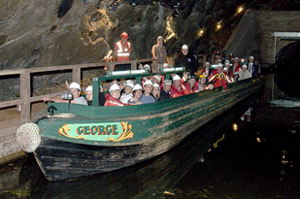 Team members boarding 'George' ready for the trip out of the cavern.