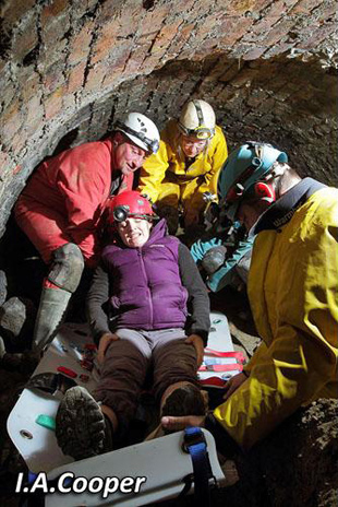 Packaging the casualty into the underground stretcher.