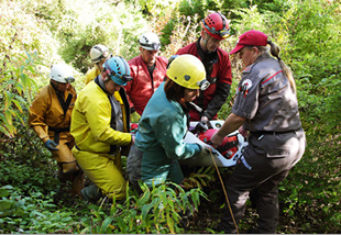 Carrying the stretcher casualty to the Red Cross ambulance.