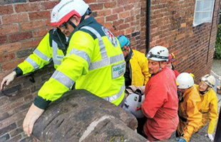 Carrying the stretcher casualty to the Red Cross ambulance.