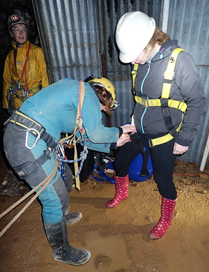 Kitting up a 'casualty' with a harness ready for the trip to the surface. (Picture: Mike Worsfold)