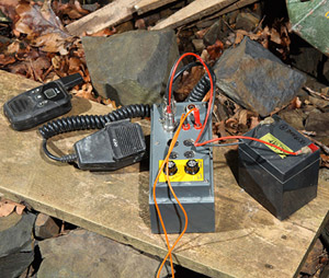 The Heyphone (center) with battery on right, microphone and PMR radio on left.