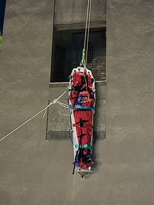 Hauling the stretcher in a vertical orientation.
