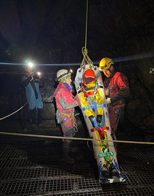 Ruth Lee in the stretcher ready for evacuation Preparing to lift the stretcher