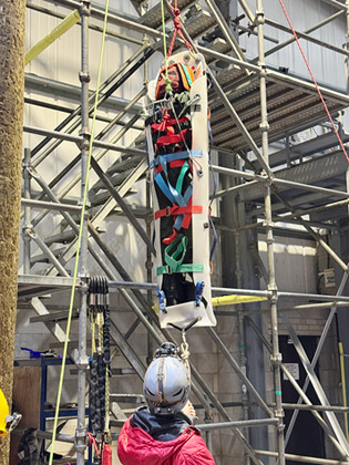 The rigging team climbing the tower
